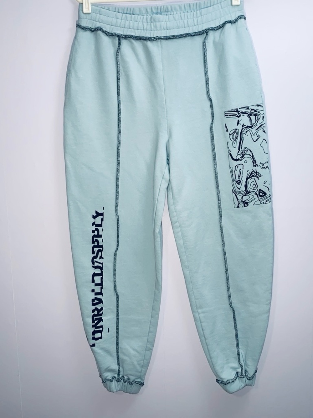 ASOS Unrvlld Spply Light Blue Sweatpants with Black Logo Design
